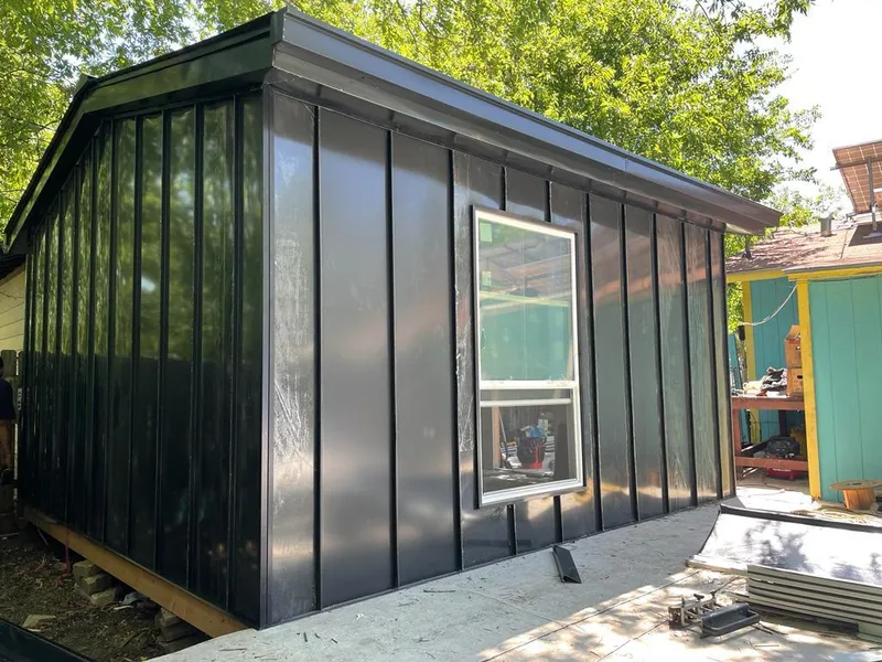 Black standing seam metal wall panels for Metal Roof Installation in Allendale