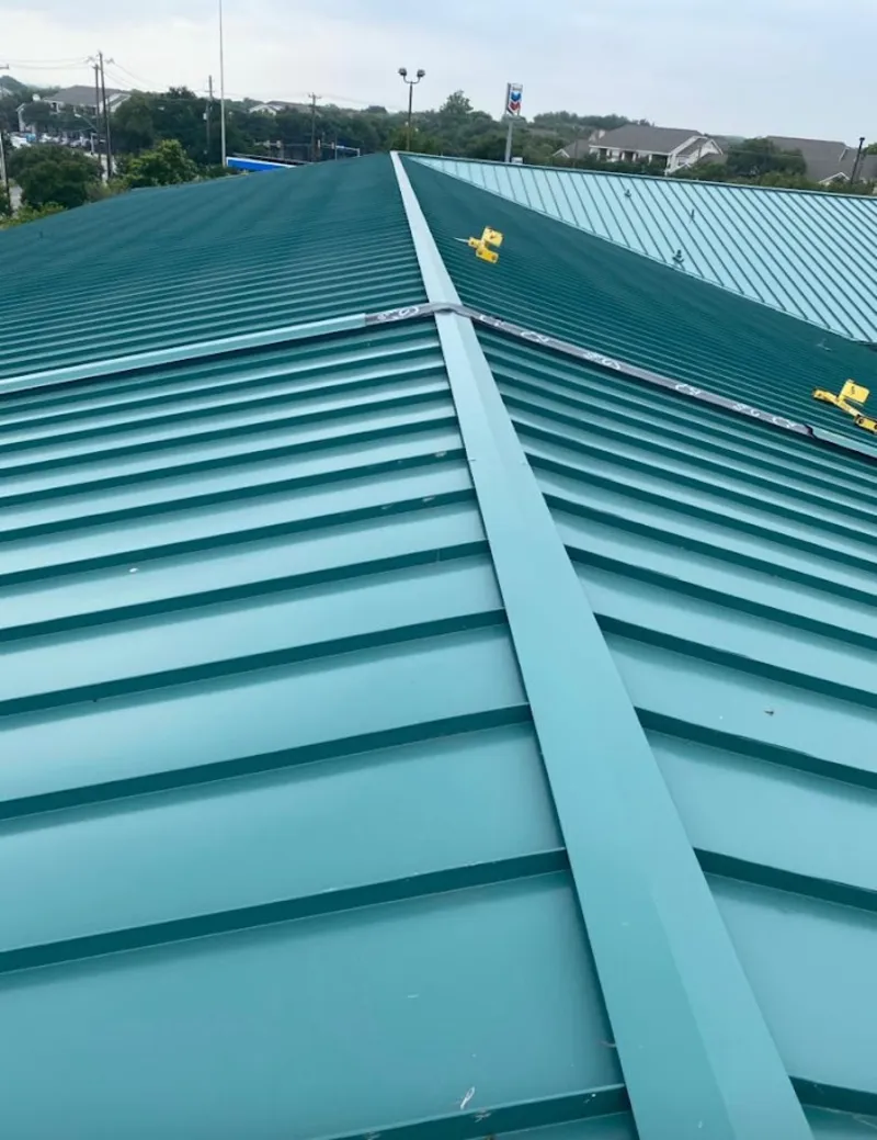 Green commercial metal roof ridge and valley for Metal Roof Repair in Allendale
